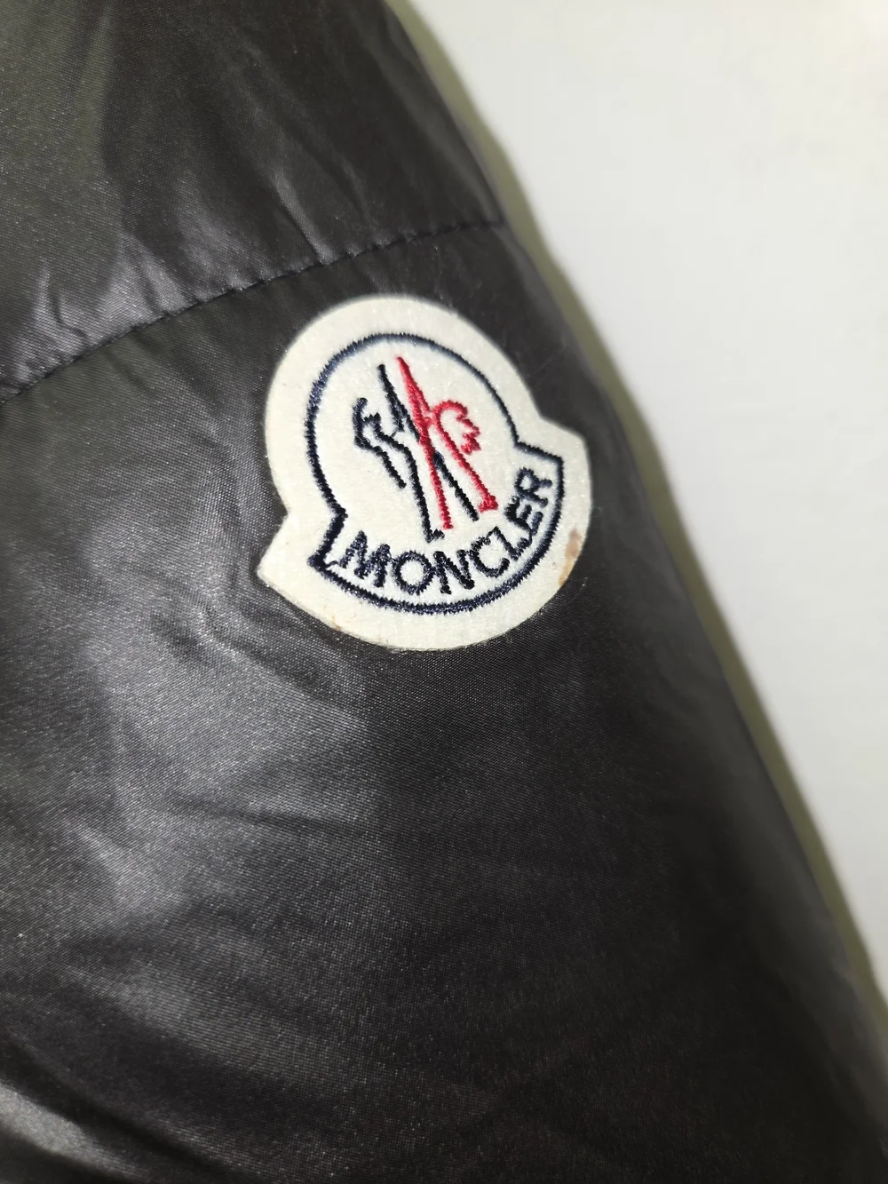 Moncler Black Shiny Puffer Jacket with Comic Care Label